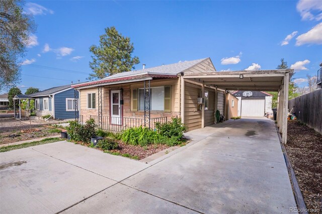 1910 S King St, Denver, CO 80219 - ranch-style home featuring a porch, driveway, and stone siding