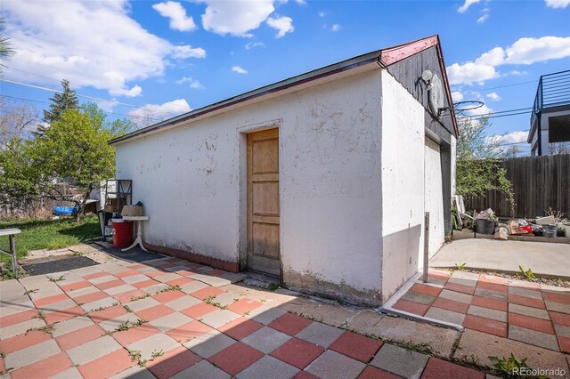 1910 S King St, Denver, CO 80219 - view of property exterior with a patio area and stucco siding