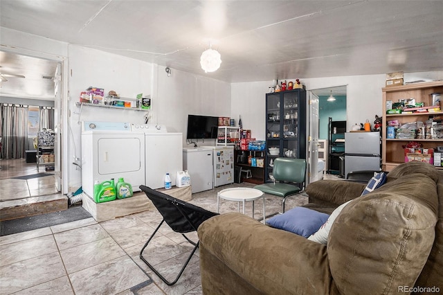 1910 S King St, Denver, CO 80219 - living area with washer and clothes dryer and tile patterned floors