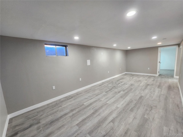 basement featuring light hardwood / wood-style floors