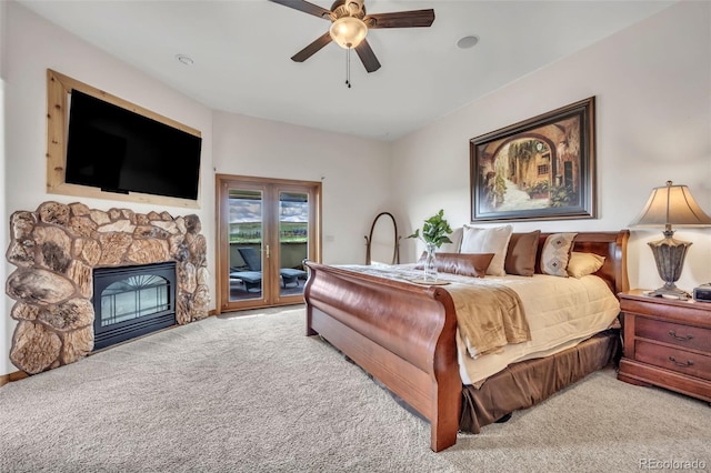 15125 Spring Valley Rd, Larkspur, CO 80118 - carpeted bedroom with access to outside, a fireplace, and a ceiling fan