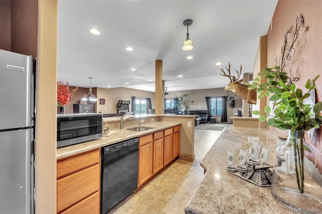 15125 Spring Valley Rd, Larkspur, CO 80118 - kitchen with stainless steel appliances, open floor plan, recessed lighting, hanging light fixtures, and a peninsula