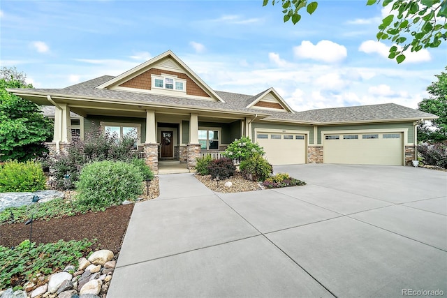 craftsman house with a garage and covered porch