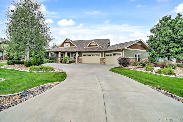 craftsman-style house with a garage and a front yard