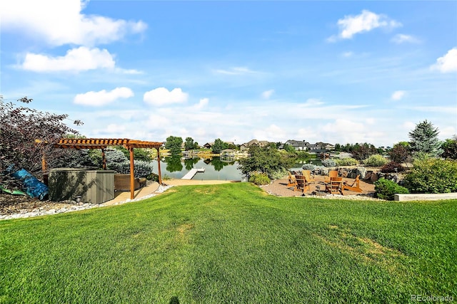 view of yard with a water view and a pergola