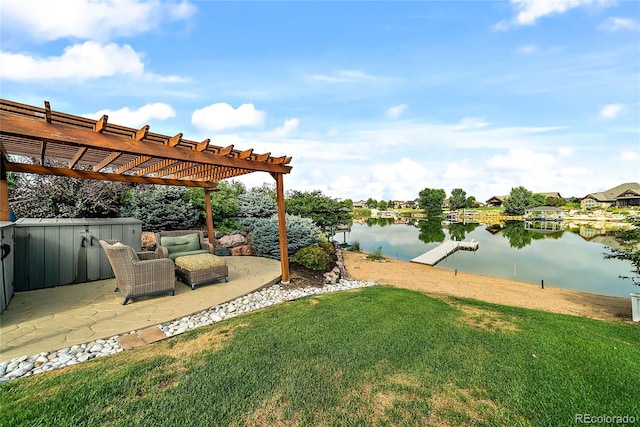 view of yard featuring a patio, a water view, and a pergola