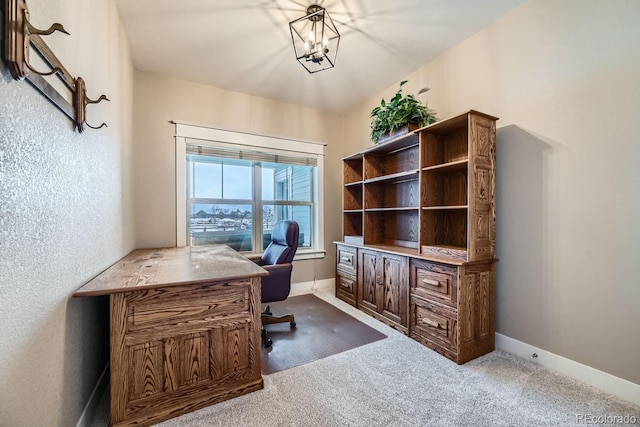 office area featuring carpet flooring and a chandelier