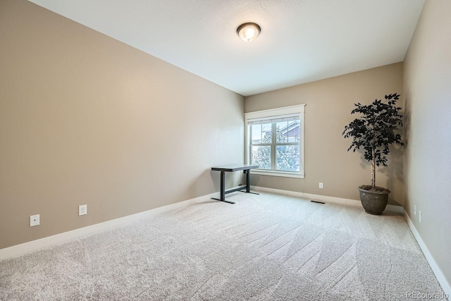 unfurnished room with carpet floors