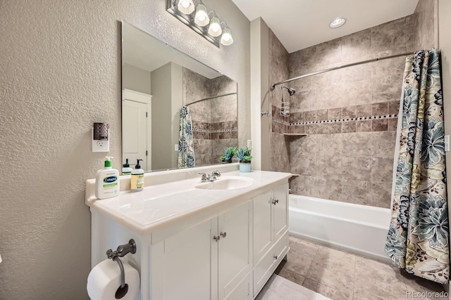 bathroom with vanity, shower / tub combo with curtain, and tile patterned floors