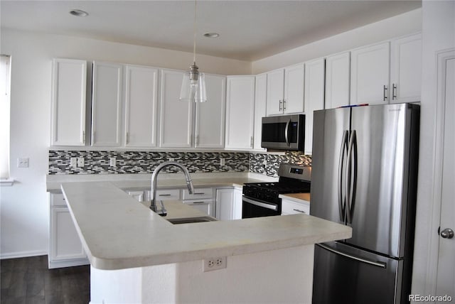 kitchen with sink, white cabinets, and stainless steel appliances