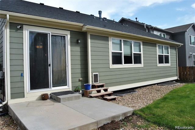 rear view of property featuring a patio area