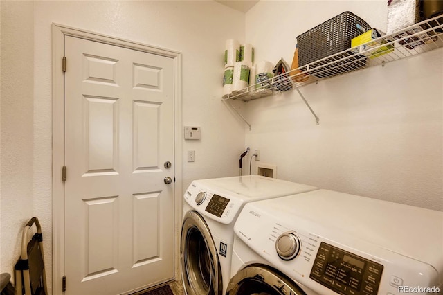 laundry room with washer and clothes dryer