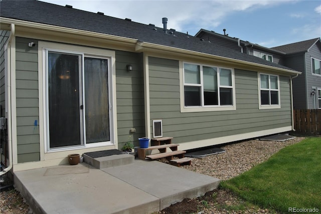 rear view of property featuring a patio