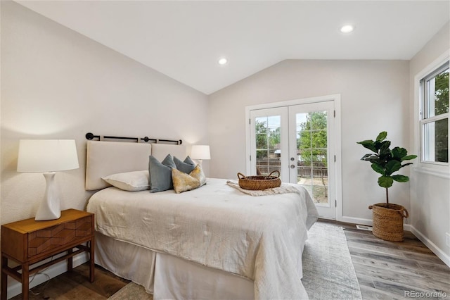 bedroom featuring access to outside, french doors, lofted ceiling, and hardwood / wood-style flooring