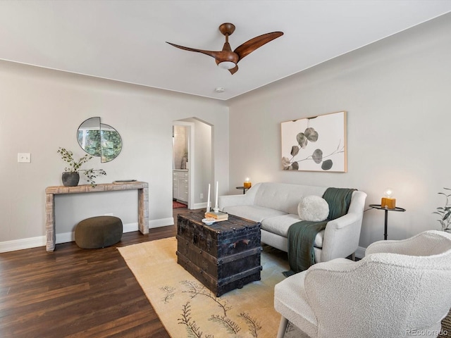 living room featuring hardwood / wood-style flooring and ceiling fan