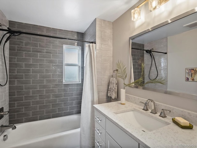 bathroom with visible vents, shower / bath combo with shower curtain, and vanity