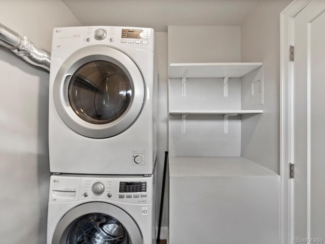 laundry room featuring laundry area and stacked washer / dryer