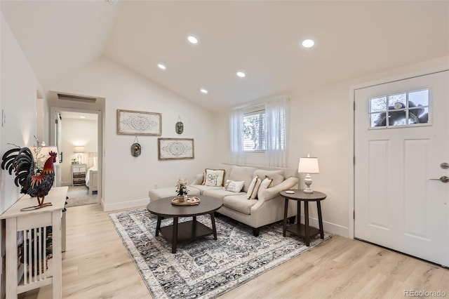 8985 Lander St, Westminster, CO 80031 - living room featuring light wood finished floors, lofted ceiling, recessed lighting, and baseboards