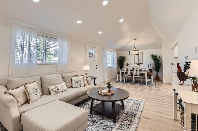 8985 Lander St, Westminster, CO 80031 - living room with healthy amount of natural light, light wood-style flooring, recessed lighting, a chandelier, and baseboards