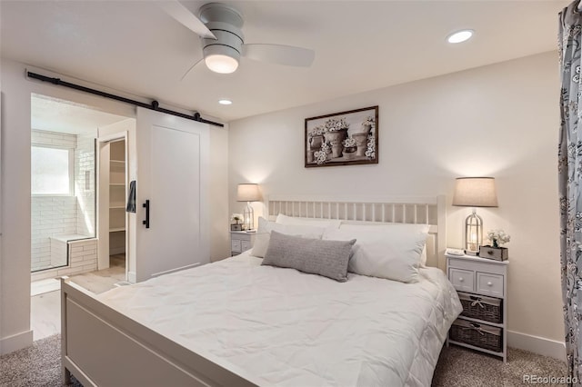 8985 Lander St, Westminster, CO 80031 - carpeted bedroom featuring a barn door, baseboards, recessed lighting, a ceiling fan, and ensuite bathroom