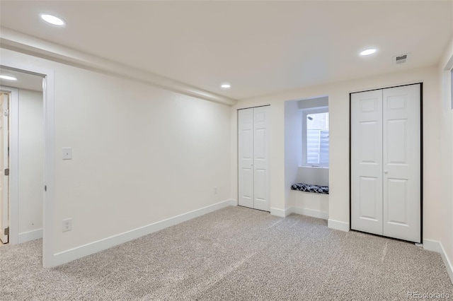 8985 Lander St, Westminster, CO 80031 - unfurnished bedroom with two closets, light colored carpet, recessed lighting, and baseboards