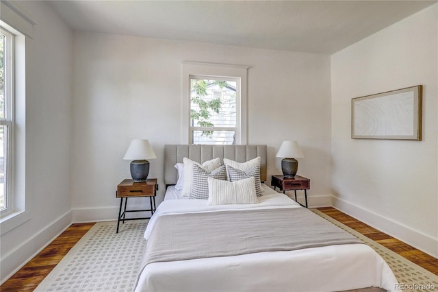 4818 Bryant St, Denver, CO 80221 - bedroom featuring wood finished floors and baseboards