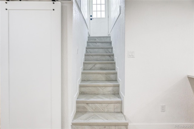 4818 Bryant St, Denver, CO 80221 - stairs with marble finish flooring and a barn door