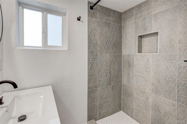 4818 Bryant St, Denver, CO 80221 - full bath featuring tiled shower and a textured wall