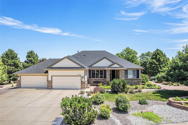 5289 Fairfield Cir, Castle Rock, CO 80104 - view of front facade with driveway, a garage, and stone siding
