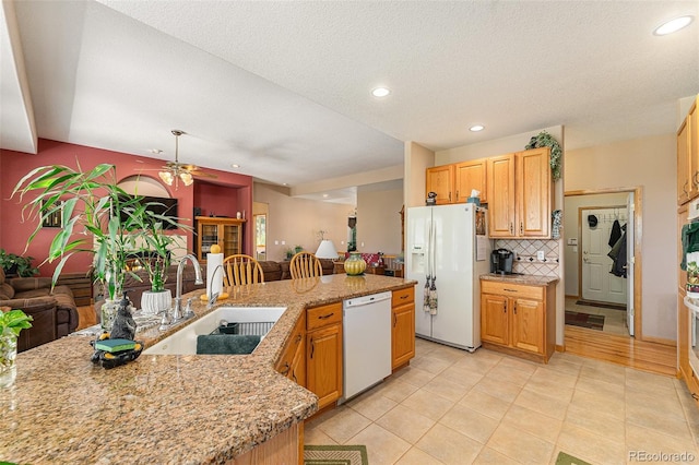 5289 Fairfield Cir, Castle Rock, CO 80104 - kitchen featuring white appliances, backsplash, recessed lighting, a ceiling fan, and light tile patterned floors