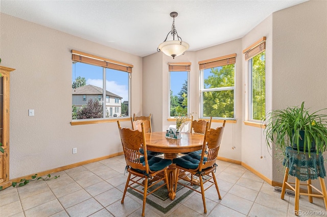 5289 Fairfield Cir, Castle Rock, CO 80104 - dining space with healthy amount of natural light, light tile patterned floors, and a textured wall