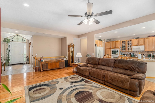 5289 Fairfield Cir, Castle Rock, CO 80104 - living area with light wood-type flooring, a ceiling fan, and recessed lighting