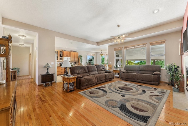 5289 Fairfield Cir, Castle Rock, CO 80104 - living area featuring light wood-style floors, ceiling fan, and recessed lighting