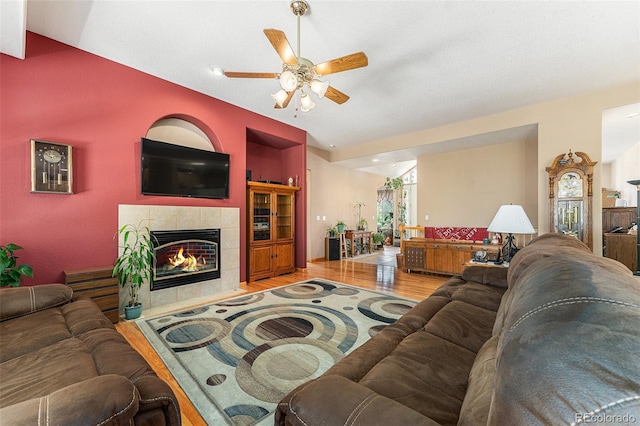 5289 Fairfield Cir, Castle Rock, CO 80104 - living area featuring wood finished floors, ceiling fan, and a tile fireplace