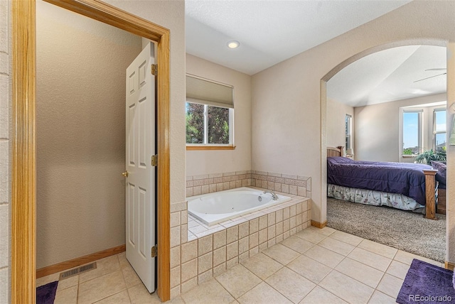 5289 Fairfield Cir, Castle Rock, CO 80104 - ensuite bathroom with a tub with jets, tile patterned flooring, and recessed lighting