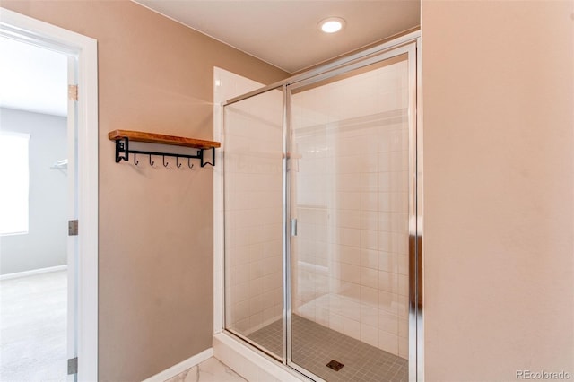 full bathroom with baseboards, a shower stall, and recessed lighting