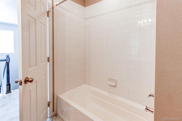 bathroom featuring washtub / shower combination