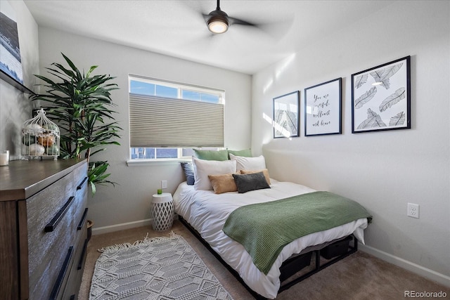 carpeted bedroom featuring a ceiling fan and baseboards