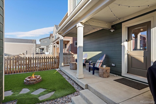 exterior space featuring fence and a fire pit