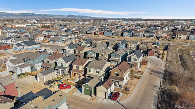 drone / aerial view with a residential view and a mountain view