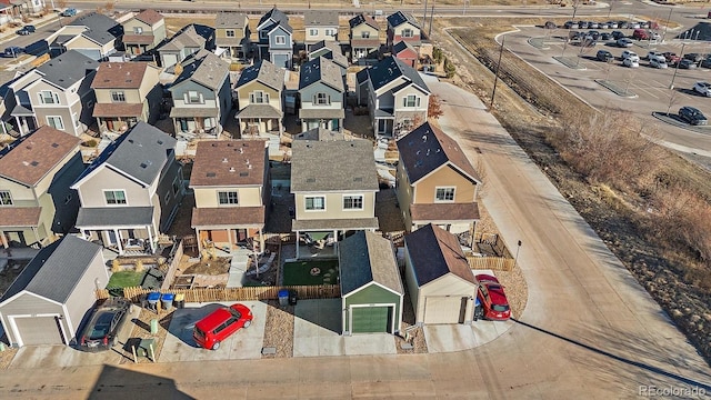 birds eye view of property with a residential view