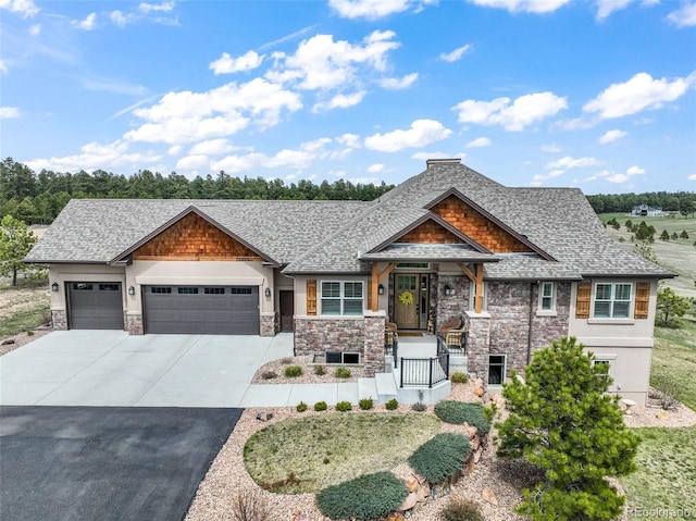 17275 Gwilym Ct, Monument, CO 80132 - view of front of property with driveway, an attached garage, stone siding, roof with shingles, and stucco siding