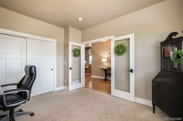 17275 Gwilym Ct, Monument, CO 80132 - home office featuring french doors, light carpet, and baseboards