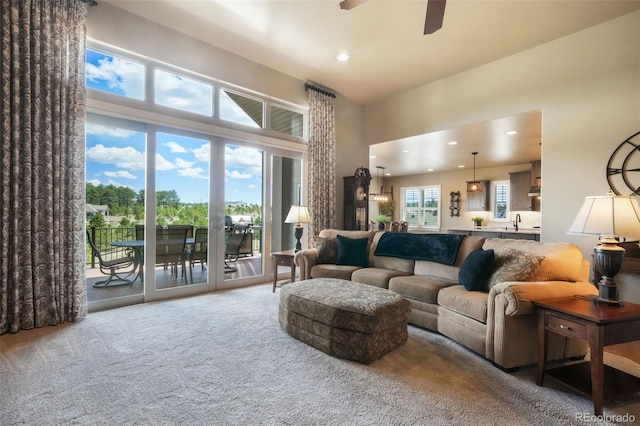 17275 Gwilym Ct, Monument, CO 80132 - living area featuring carpet flooring, ceiling fan, a high ceiling, and recessed lighting