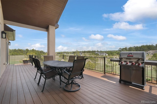 17275 Gwilym Ct, Monument, CO 80132 - deck with outdoor dining space and a grill