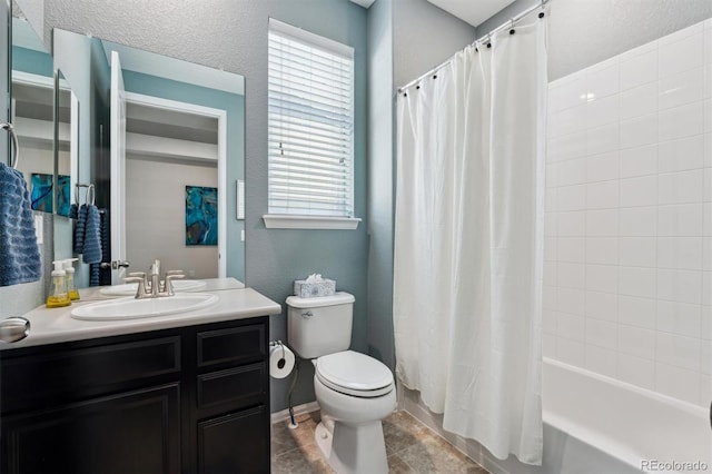 bathroom featuring toilet, shower / bath combo with shower curtain, vanity, tile patterned flooring, and baseboards