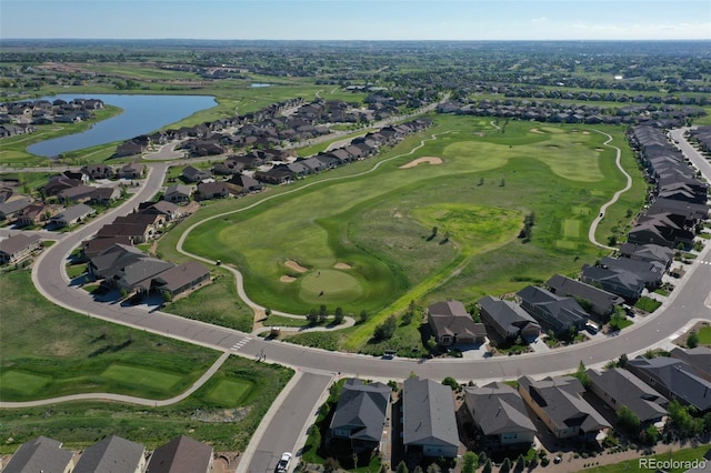 birds eye view of property featuring a residential view, view of golf course, and a water view