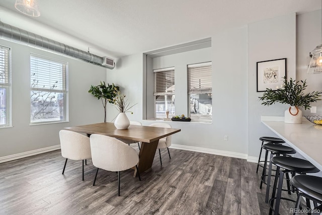 dining room with dark hardwood / wood-style flooring