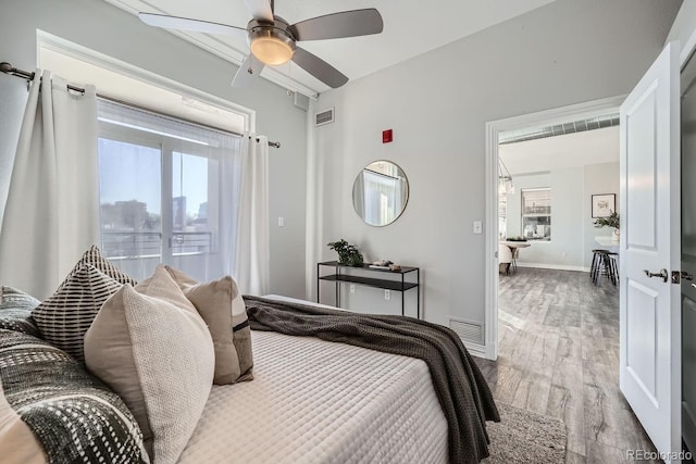 bedroom with ceiling fan and light wood-type flooring