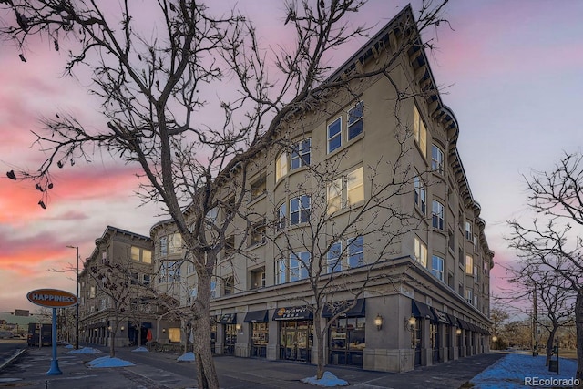 view of outdoor building at dusk